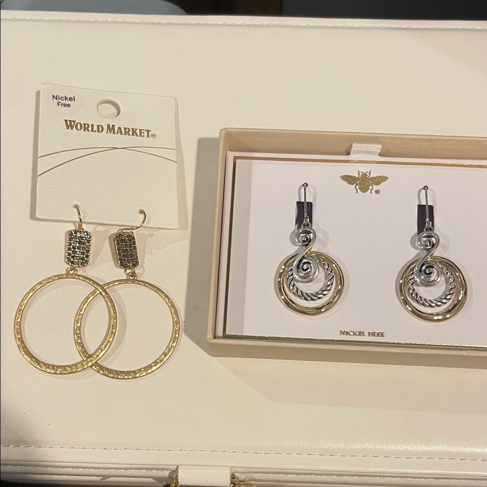 Two pair women’s gold/silver hoop earrings. Nickel free.
